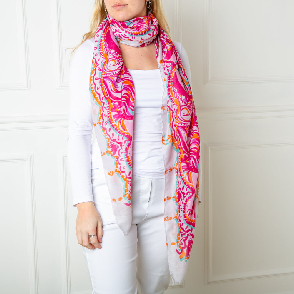 The beautiful fuchsia pink Bali Scarf which can be worn in so many ways for spring and summer outfits