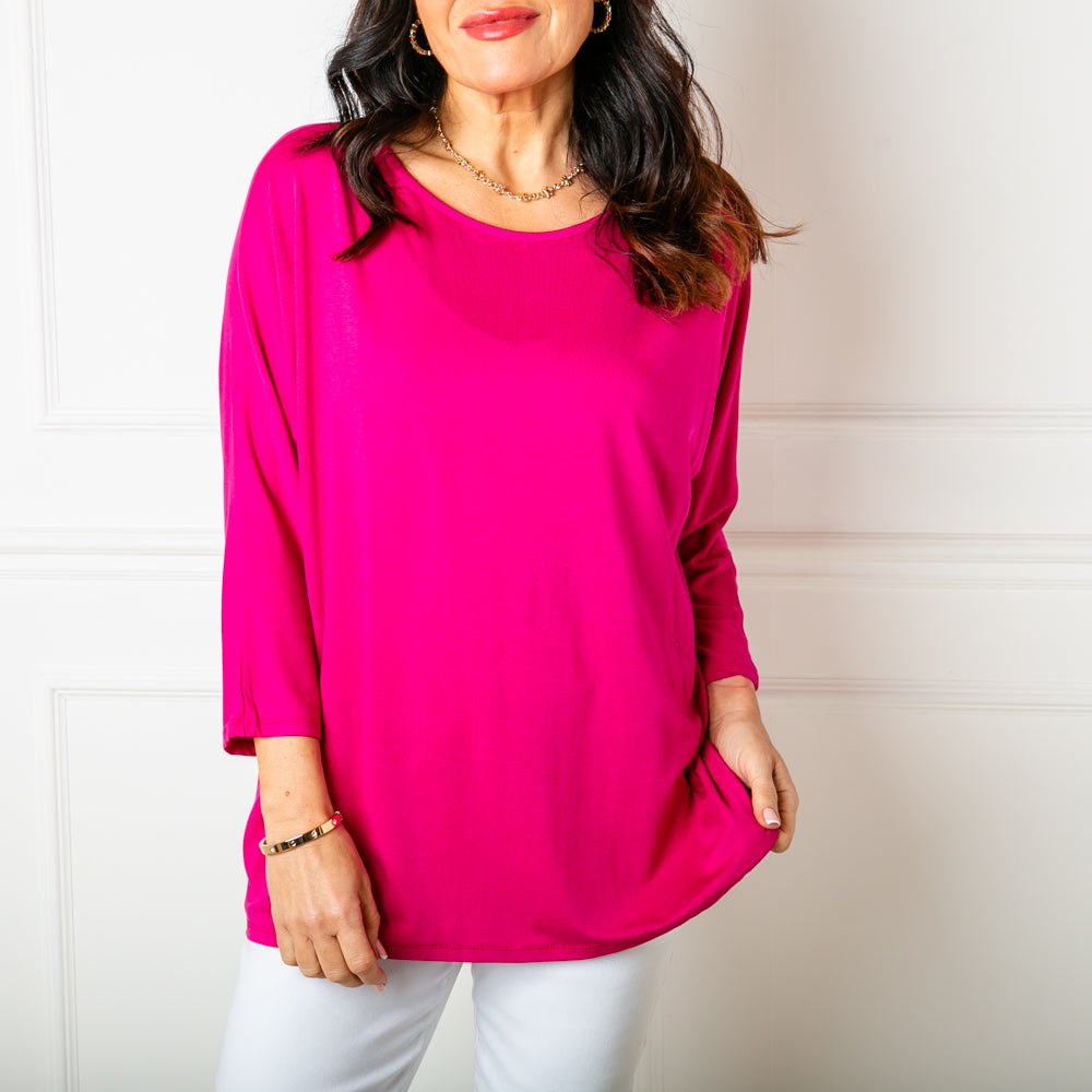 The fuchsia pink Batwing T-shirt with 3/4 length sleeves and a round neckline