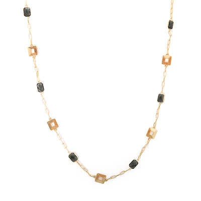 Casey necklace in gold with black pendants and square metal pendants spread across the chain