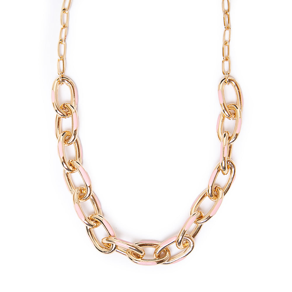 The Enya necklace in gold and pink with a chunky metal chain and a metal clasp fastening