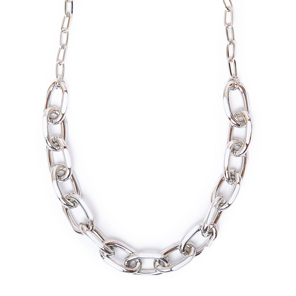 The Enya necklace in silver and white with a chunky metal chain and a metal clasp fastening