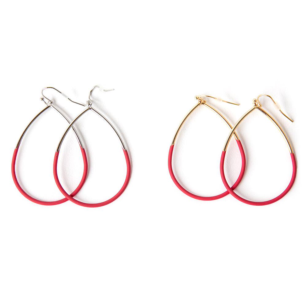 The Leah Earrings in fuchsia pink red featuring a teardrop shape. Available in golf and silver