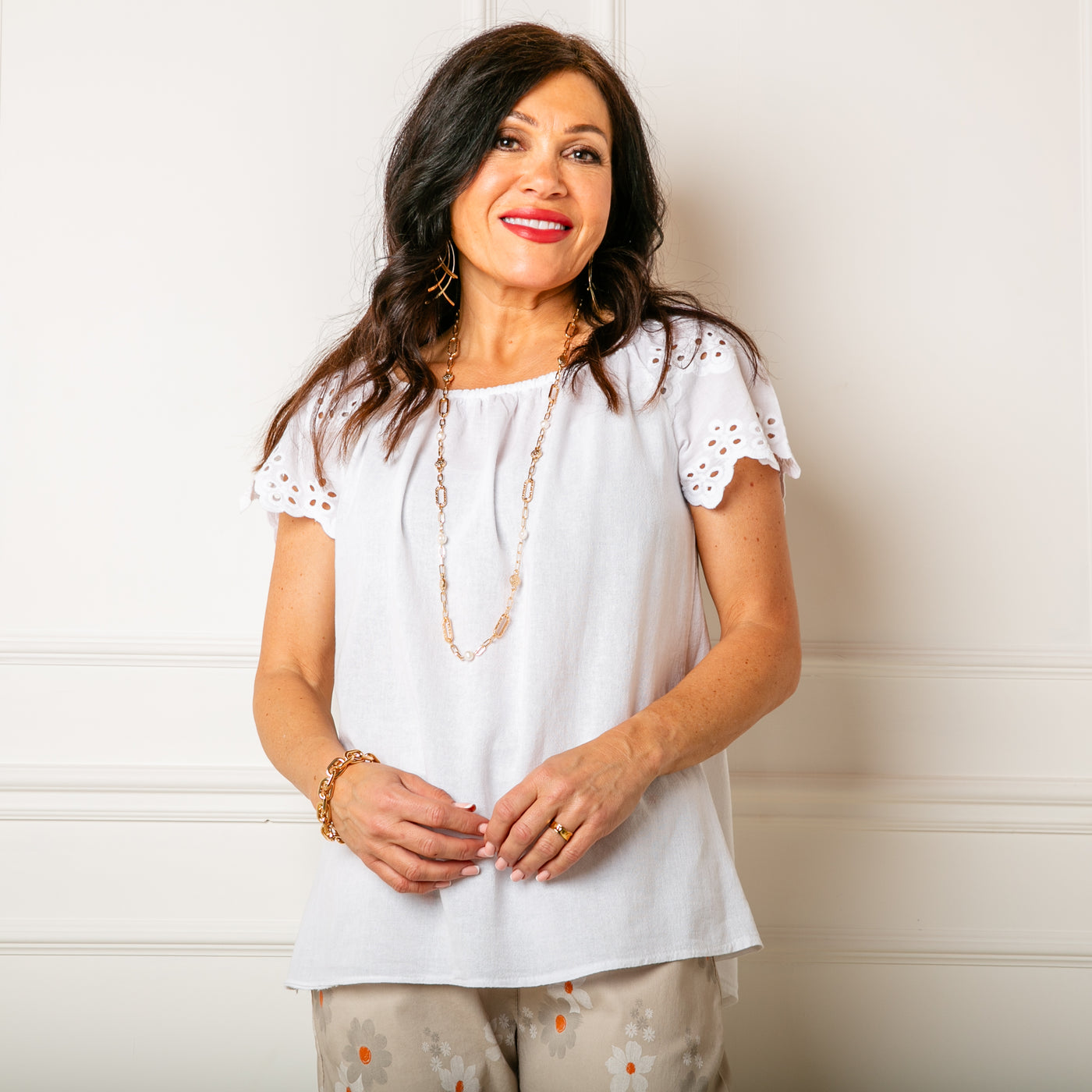 The white Linen Blend Flutter Top with an elasticated bardot neckline so the top can be worn on or off the shoulder