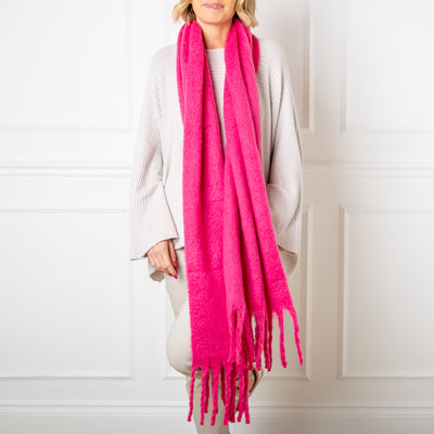 The Nelly Wool Blend Scarf in fuchsia pink made from a blend of wool and viscose