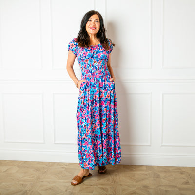 The floral blue Printed Button Maxi Dress with short puffy elasticated sleeves that can be worn on or off the shoulder