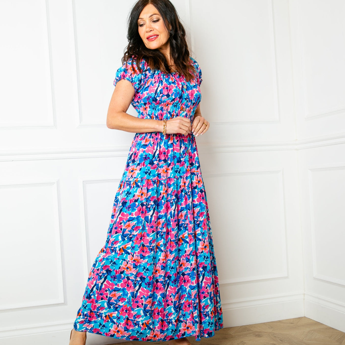 The floral blue Printed Button Maxi Dress with a maxi tiered skirt in a fun summery pattern