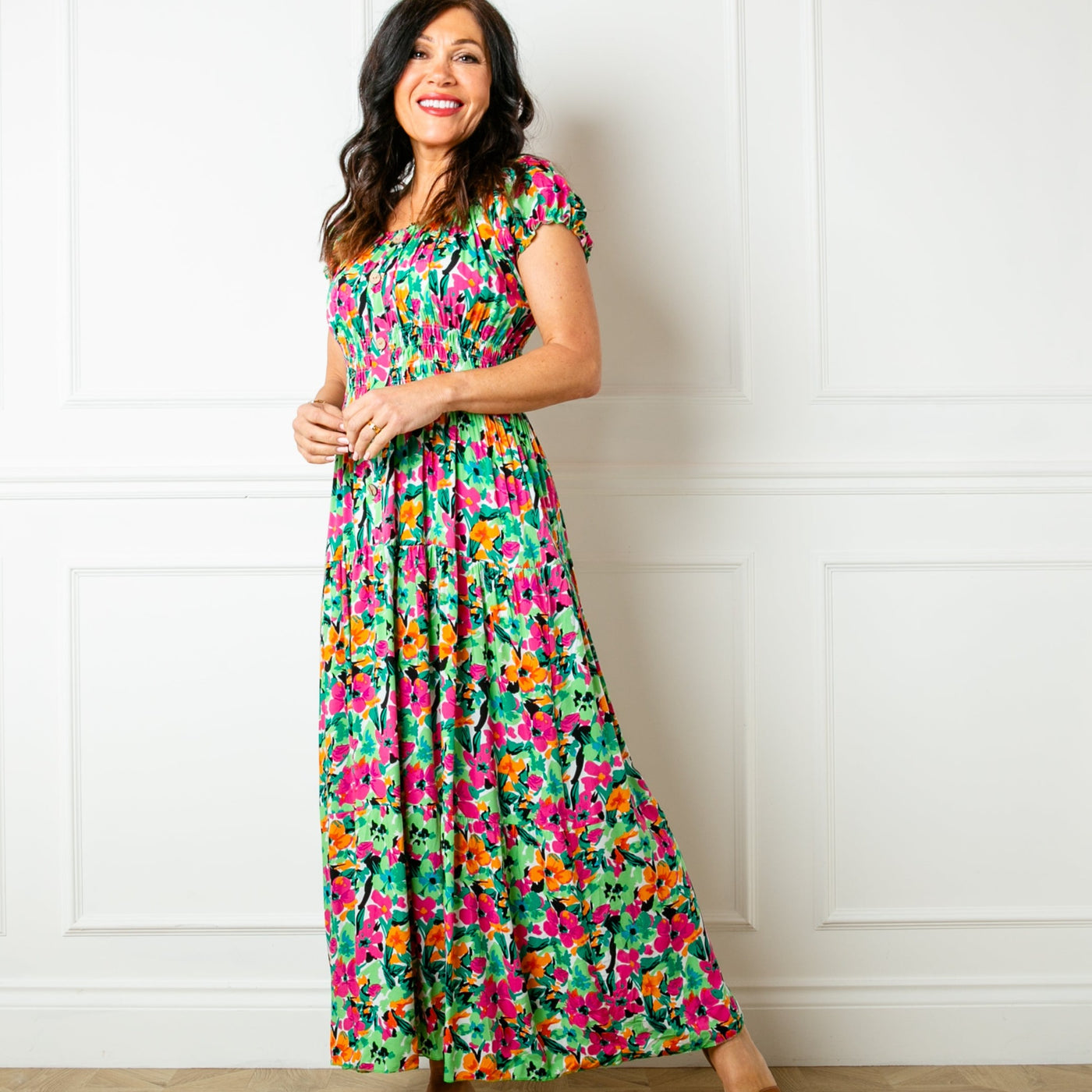 The floral green Printed Button Maxi Dress with short puffy elasticated sleeves that can be worn on or off the shoulder