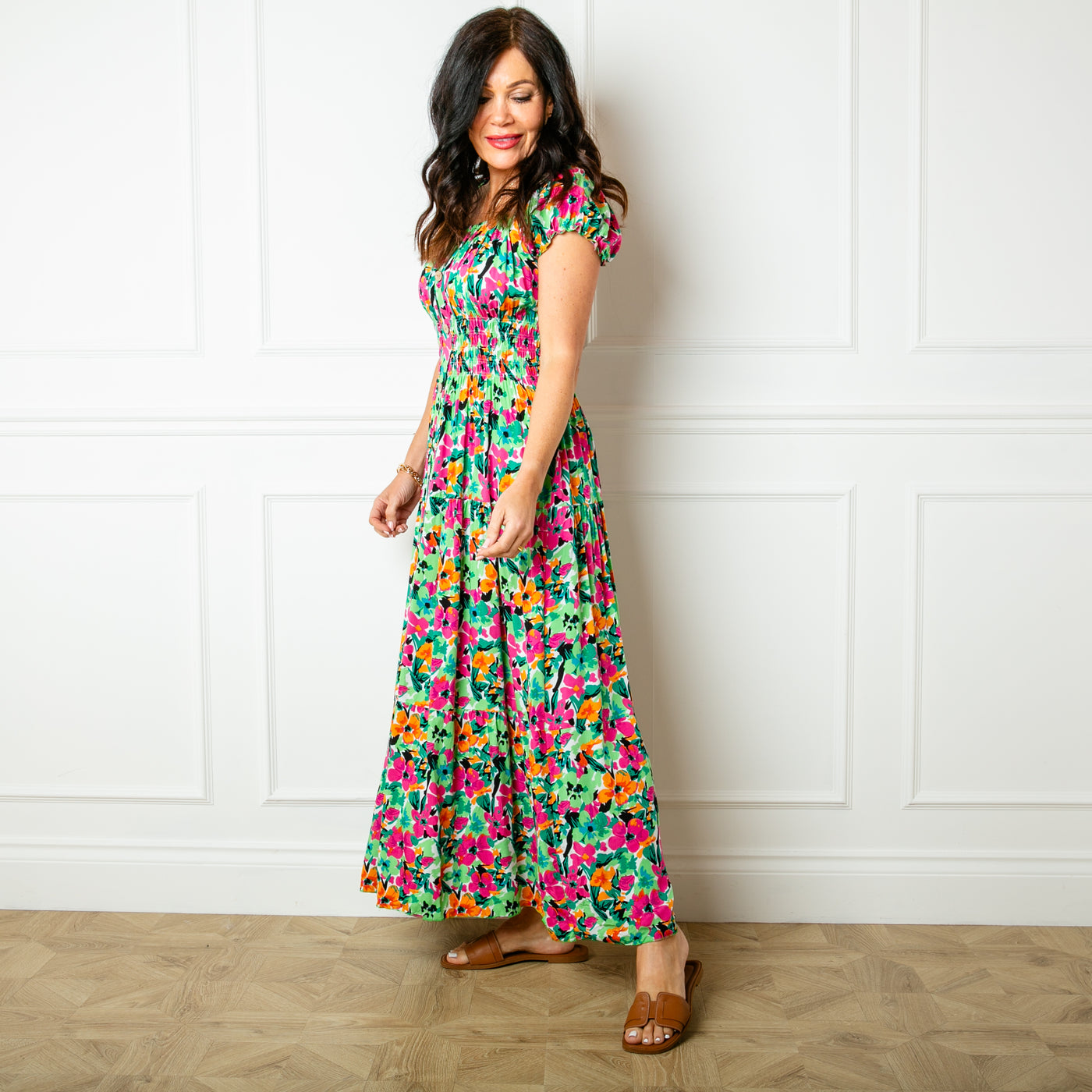 The floral green Printed Button Maxi Dress with a maxi tiered skirt in a fun summery pattern
