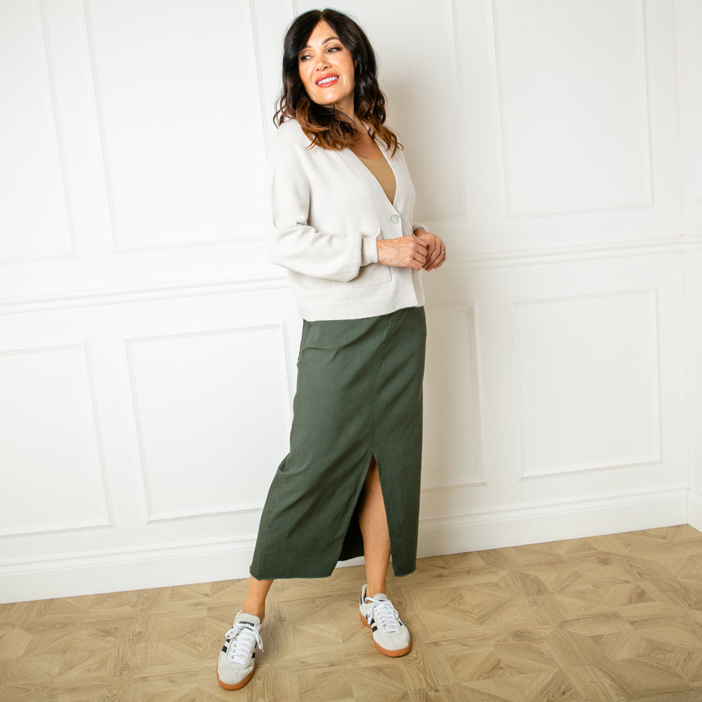 The khaki green Raw Hem Midi Skirt with an elasticated waist and drawstring detailing like our best selling stretch trousers