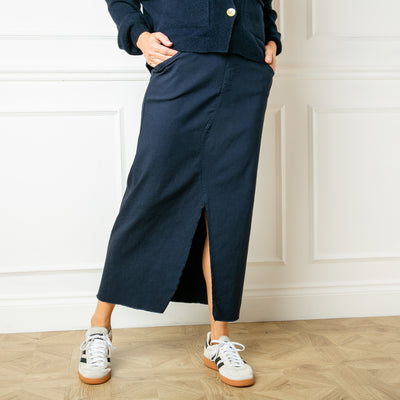 The navy blue Raw Hem Long Midi Skirt for women with side pockets on the front and larger pockets on the back