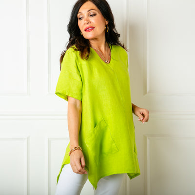 The lime green Two Pocket Linen Top with short sleeves and a rounded v neckline 