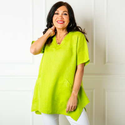 The lime green Two Pocket Linen Top with slanted pockets on either side of the waist