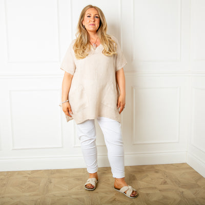 The natural cream Two Pocket Linen Top with a statement flared hemline