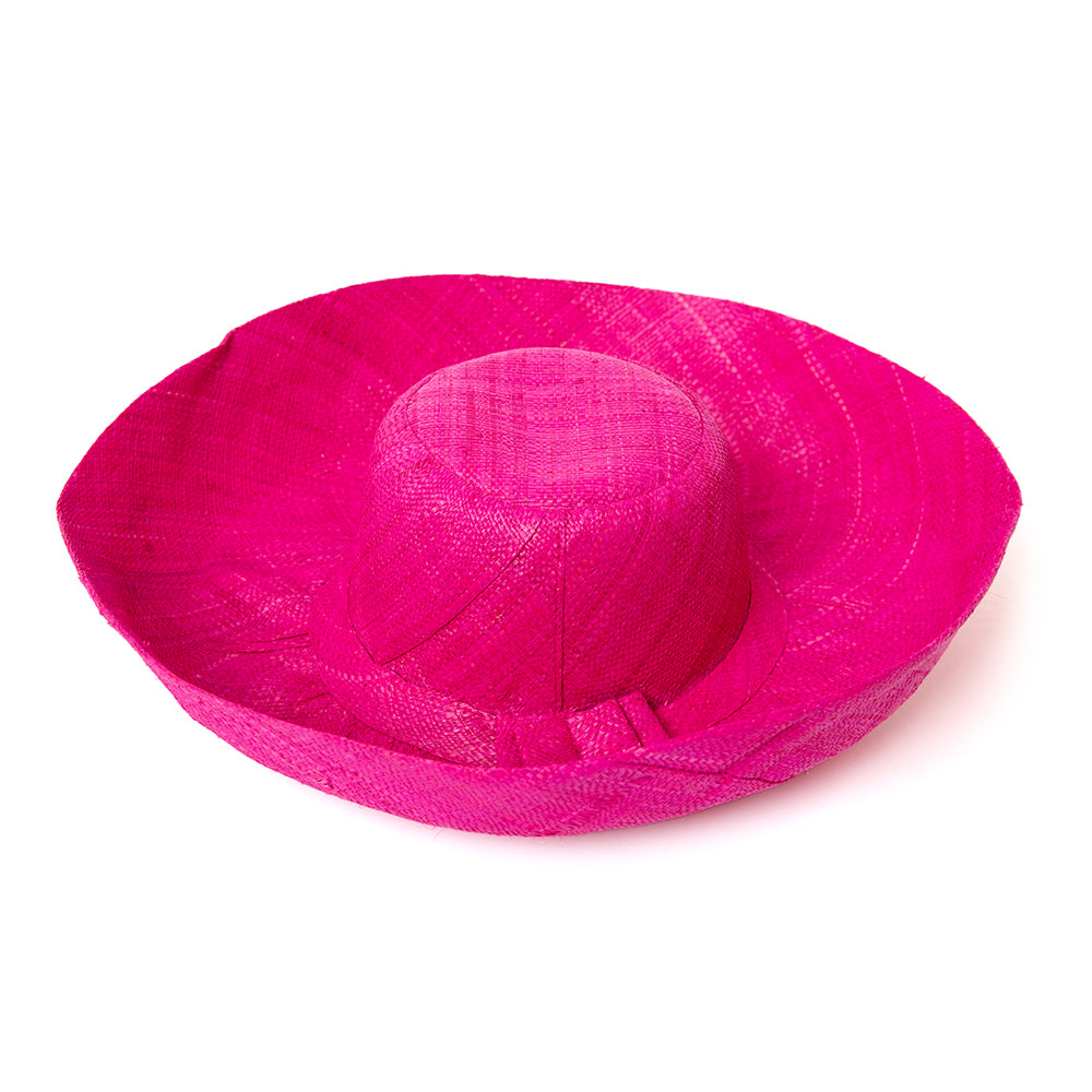 The bright pink Versailles Sun Hat which is lightweight and can be rolled up to store for travelling 