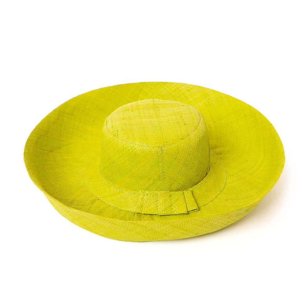 The lime green Versailles Sun Hat with a wide brim and a bow detail around the circumference 