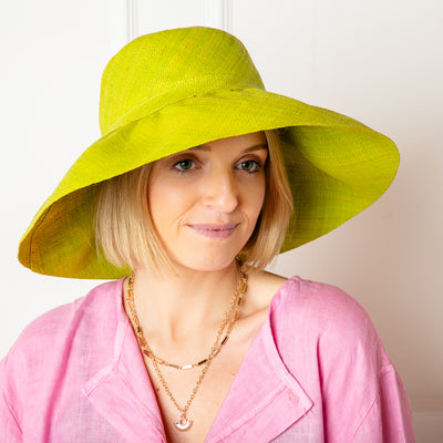 The Versailles Sun Hat in lime green handmade in Madagascar from sustainable raffia