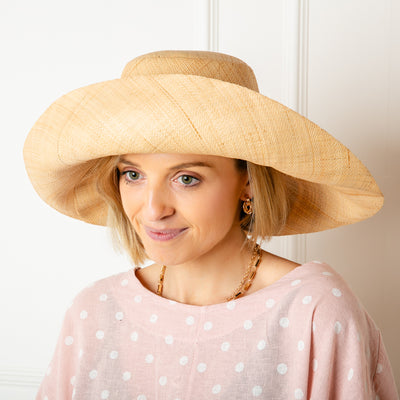 The natural brown Versailles Sun Hat Which can be styled in lots of different ways with the brim folded up or down