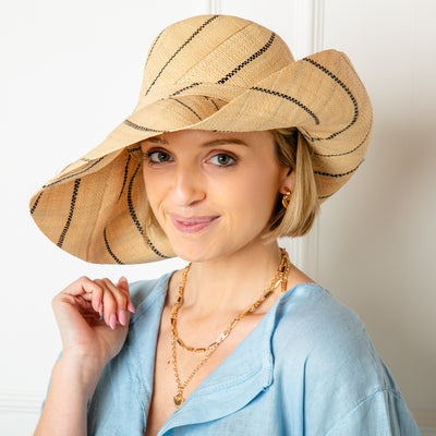 The Versailles Sun Hat in pinstripe natura brownl handmade in Madagascar from sustainable raffia