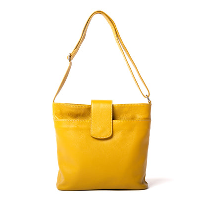 Pimlico Handbag in mustard yellow, shown from the front and including the adjustable leather strap, the fold over presstud fastening and the outside pocket. Made from Italian leather.