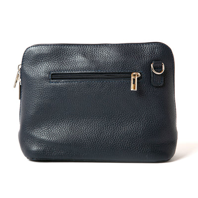 Navy blue leather Sloane bag, including adjustable strap, zip fastening, buckle detail and the outside pocket. 