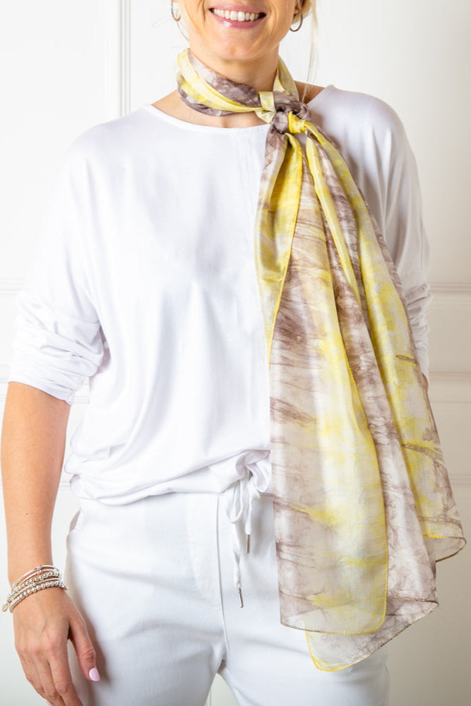 The grey and yellow tie dye print 100% silk scarf which can be worn in many different ways