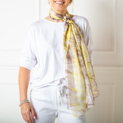 The grey and yellow tie dye print 100% silk scarf which can be worn in many different ways