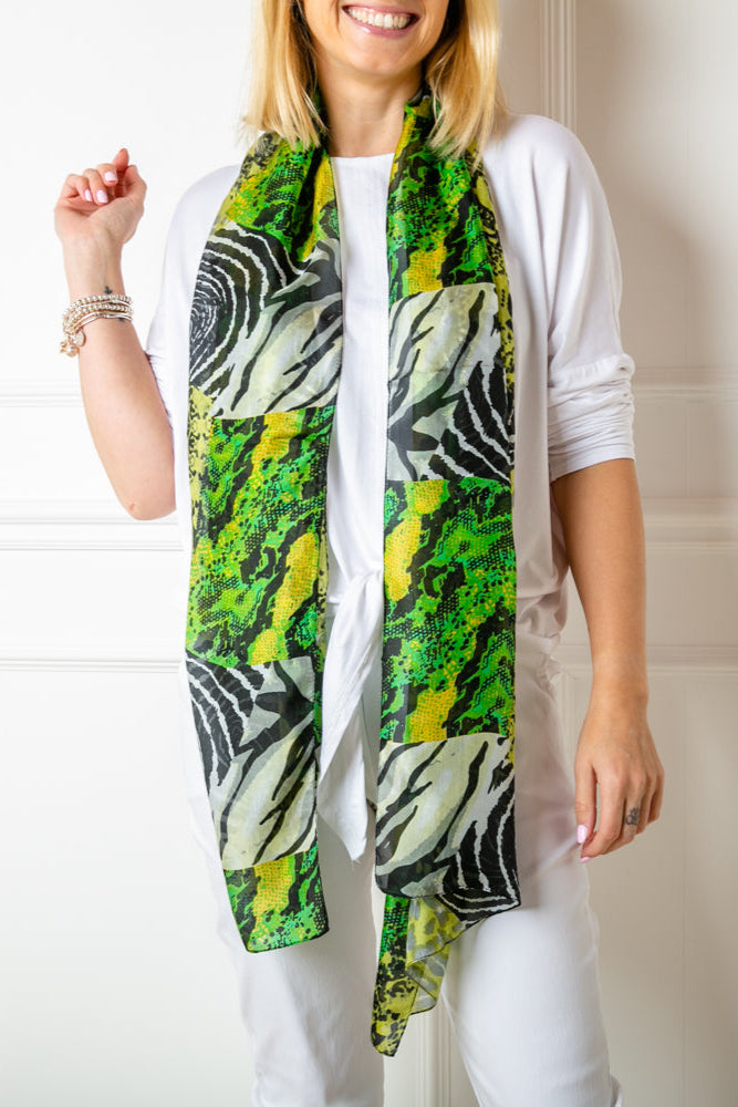The green animal print 100% silk demi scarf in a slimmer width to our regular silk scarf collection 