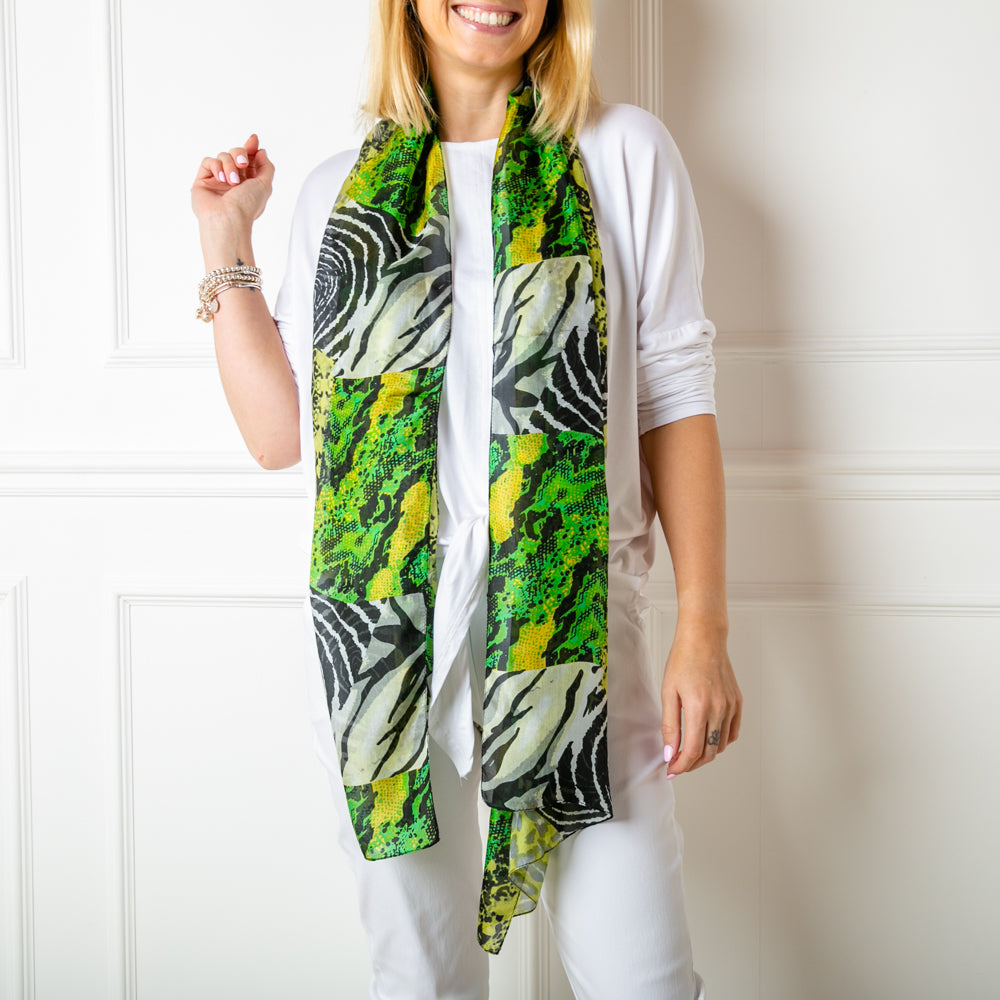 The green animal print 100% silk demi scarf in a slimmer width to our regular silk scarf collection 