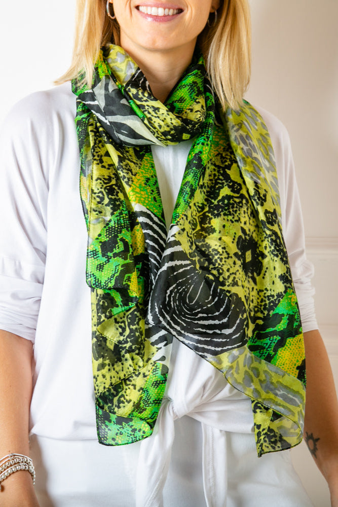 The green animal print 100% silk scarf which can be worn in many different ways