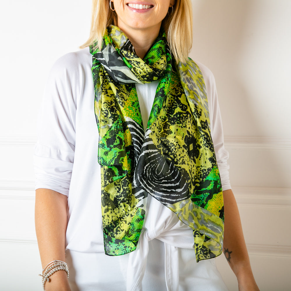 The green animal print 100% silk scarf which can be worn in many different ways