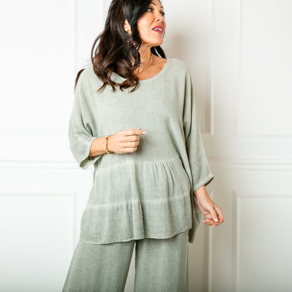 The Linen Blend Tiered Top in sage green with 3/4 length sleeves and a round neckline