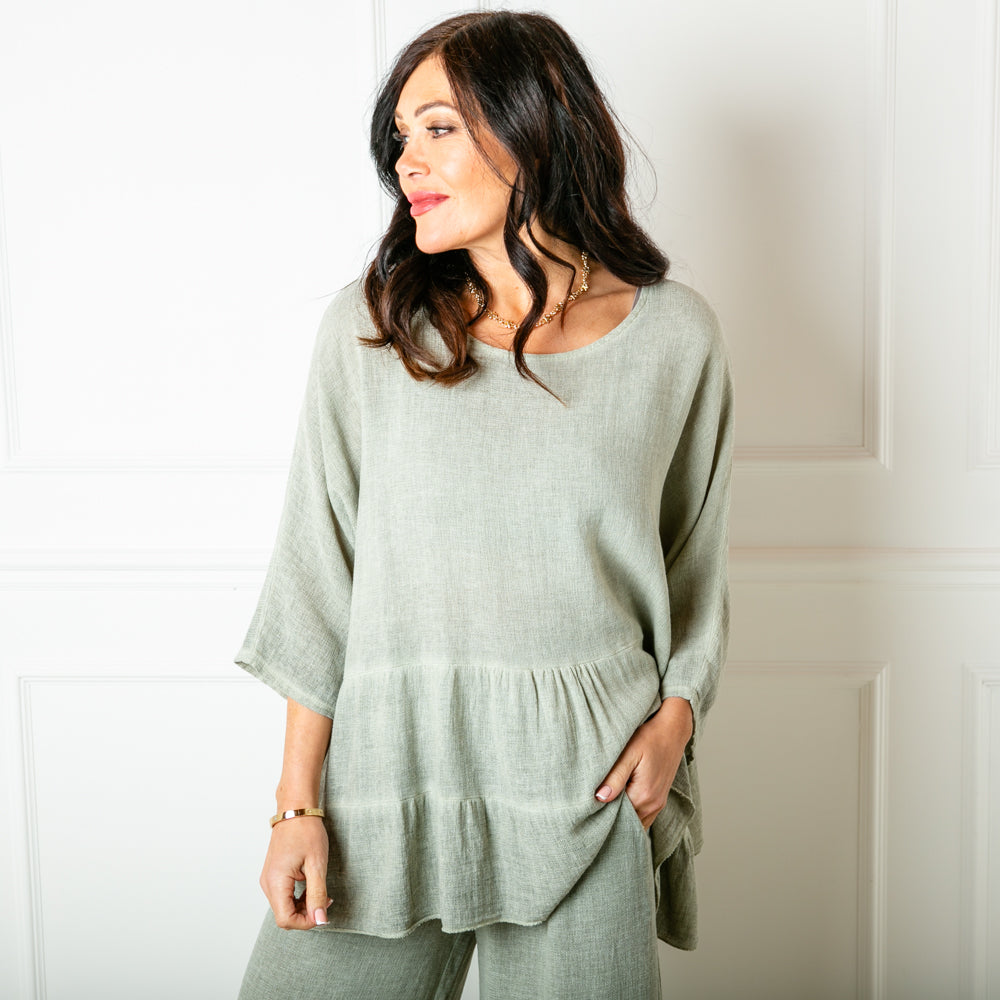 The Linen Blend Tiered Top in sage green with a loose tiered peplum silhouette