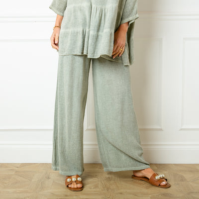 The Linen Blend Trousers in sage green with a wide leg silhouette 