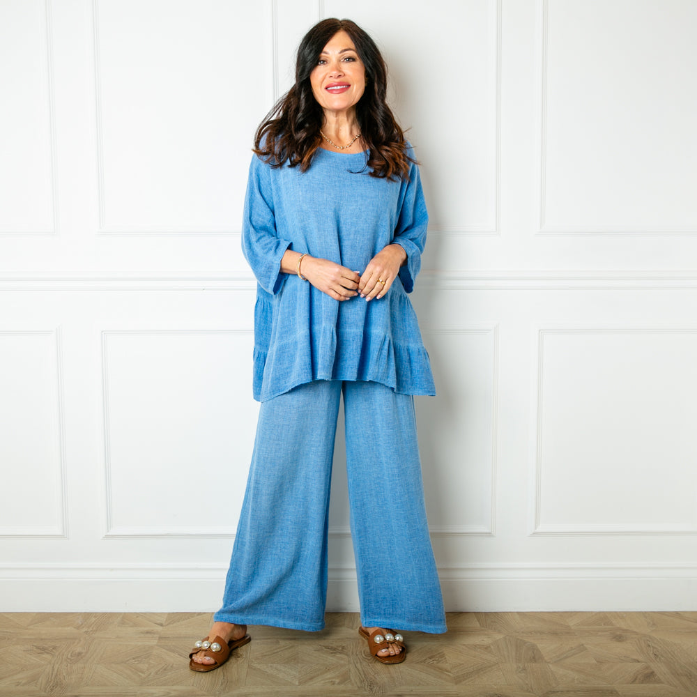 The Linen Blend Trousers in cornflower blue with a wide leg silhouette 