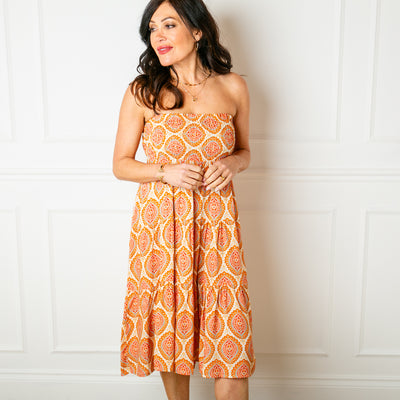Flora Stamp Tiered Skirt in orange with a wide shirred elasticated waistband 