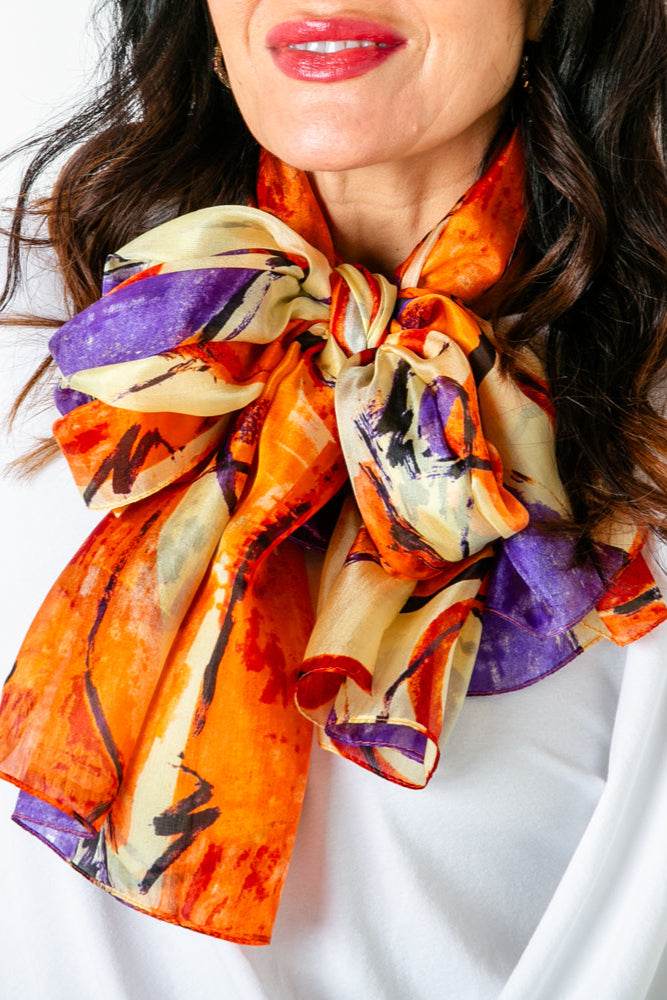 The Orange Circles Silk Scarf which makes the perfect summer accessory for your wardrobe