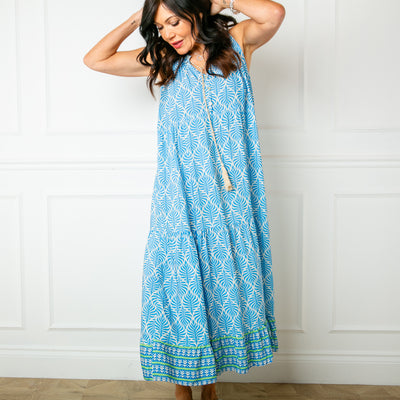 The blue All Over Print Maxi Dress with a tiered silhouette for a feminine look