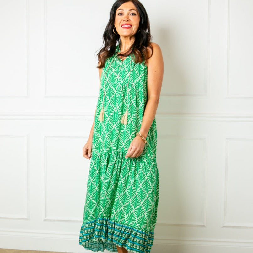 The green All Over Print Maxi Dress with a tiered silhouette for a feminine look