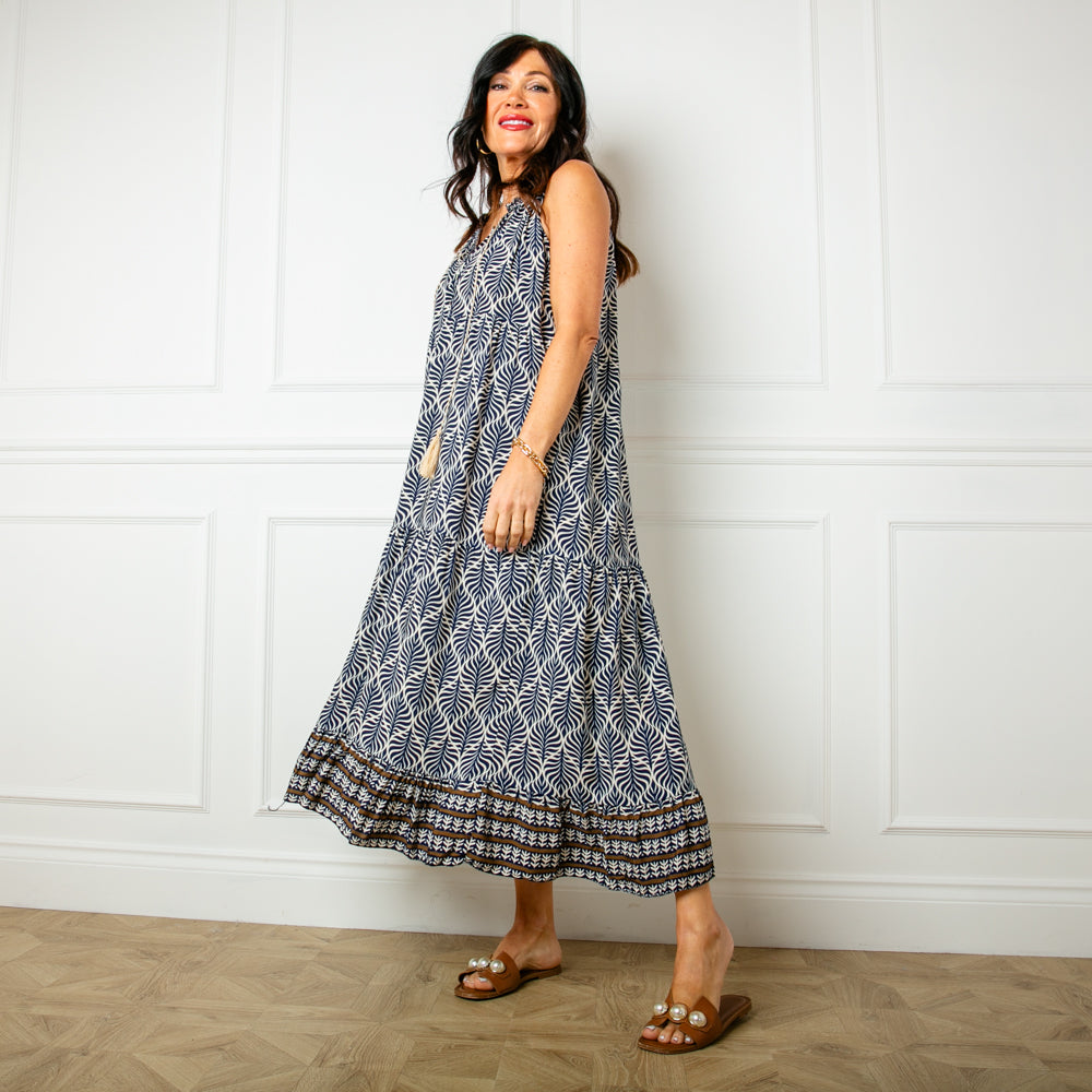 The navy blue All Over Print Maxi Dress with a tiered silhouette for a feminine look