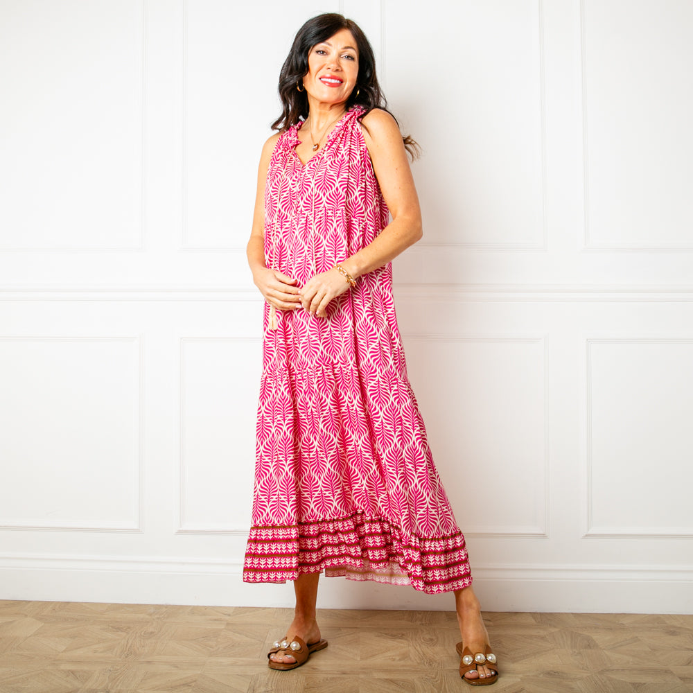 The pink All Over Print Maxi Dress with a tiered silhouette for a feminine look