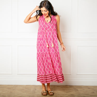 The pink All Over Print Maxi Dress featuring a vibrant leaf style print perfect for summer