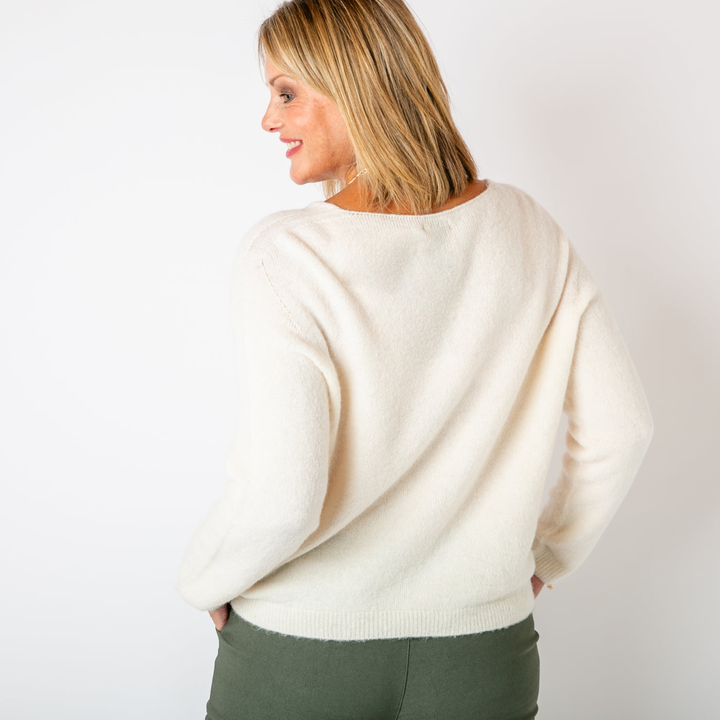 The cream Alpaca Blend V Jumper in a cropped length with a seam detail on either arm