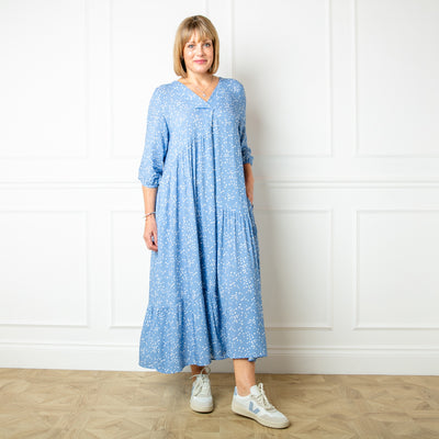 The denim blue Asymmetric 3/4 Sleeve Tea Dress in a maxi length with an alternating tiered structure down the skirt