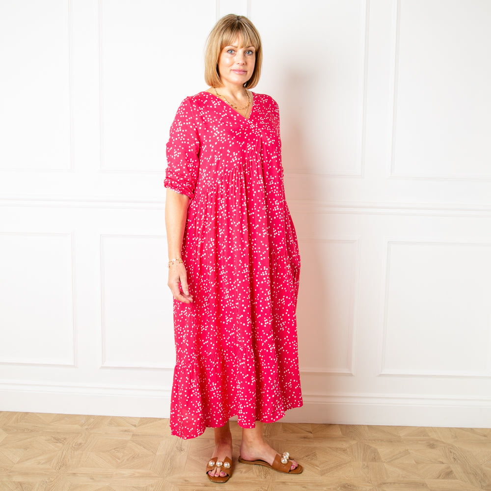 The raspberry pink Asymmetric 3/4 Sleeve Tea Dress in a maxi length with an alternating tiered structure down the skirt