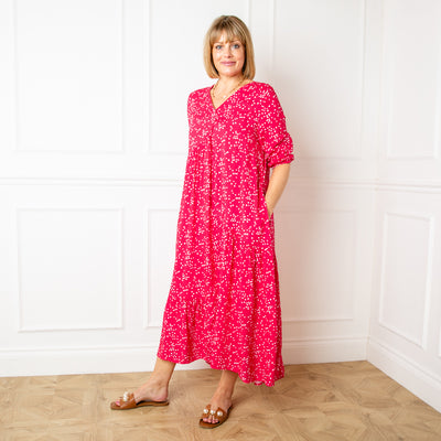The Asymmetric 3/4 Sleeve Tea Dress in raspberry pink with a neckline and sleeves that fall just below the elbow with an elasticated cuff