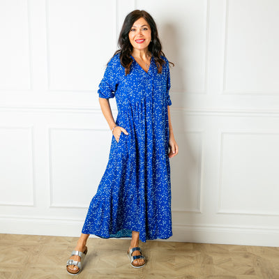 The royal blue Asymmetric 3/4 Sleeve Tea Dress in a fun spotty polka dot print with pockets on either side of the torso