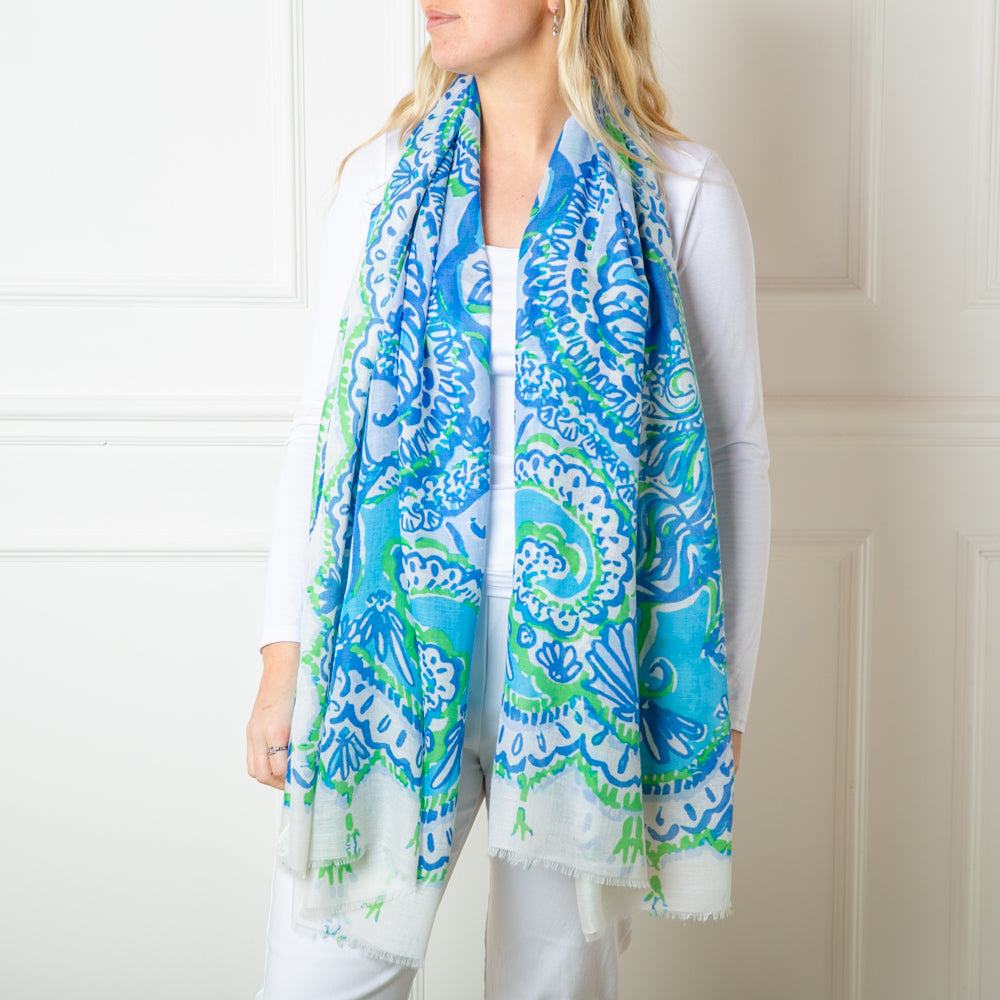 The Blue Bali Scarf featuring a beautiful intricate paisley pattern print including floral designs