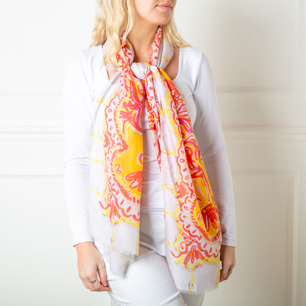 The beautiful orange Bali Scarf which can be worn in so many ways for spring and summer outfits