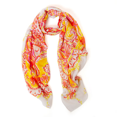 The orange Bali Scarf with a white background and hints of yellow and pink