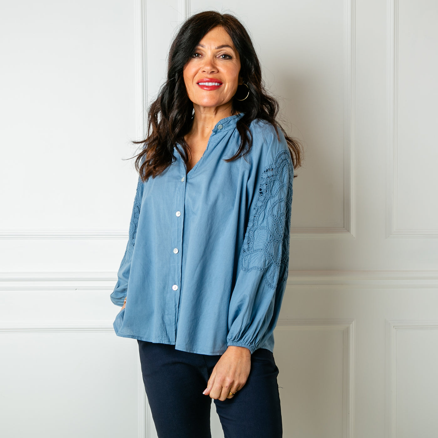 The denim blue Balloon Sleeve Shirt with a collarless V neckline and buttons down the front